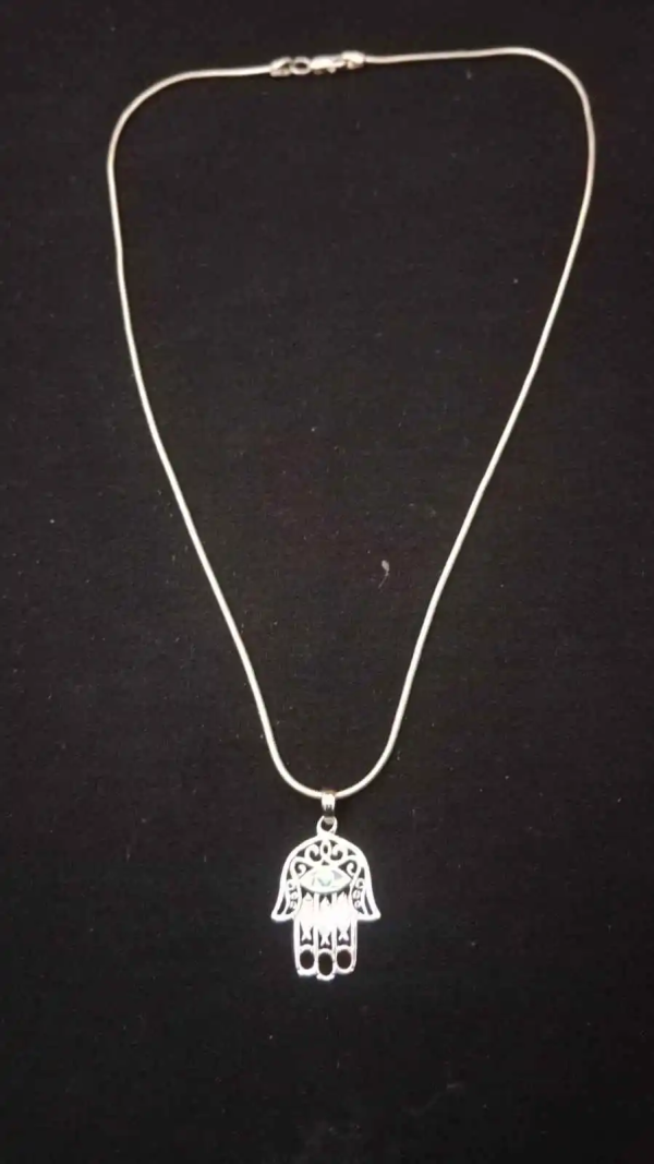 hamsa-hand-amulet-12 “I bought this Hamsa Hand Necklace because I was looking for something stylish yet protective — and I couldn’t be happier! The quality is excellent, the design is beautiful, and I genuinely feel more at peace when wearing it. The combination of the Hamsa hand and the evil eye charm makes me feel shielded from negativity, and I love that it’s adjustable, so I can layer it with other necklaces. I’ve received so many compliments, and I even bought another as a gift for my sister. Perfect for anyone who wants both fashion and spiritual protection!”