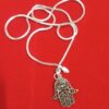 hamsa hand, evil eye remover, silver hamsa necklace, hamsa hand amulet, evil eye protection, silver chain amulet, spiritual jewelry, protection necklace, hamsa pendant, evil eye charm, silver talisman, energy cleansing jewelry, protective amulet, good luck